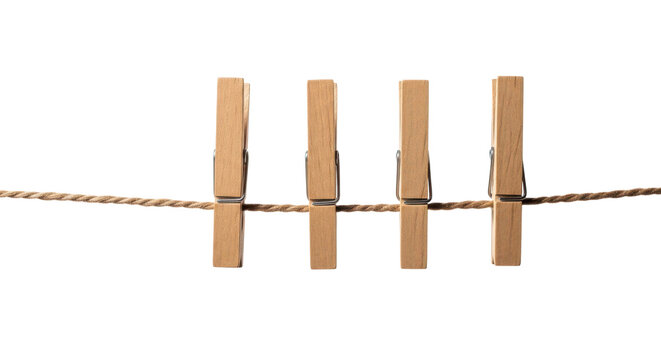 Four wooden clothespins hanging on a brown rope isolated on transparent background