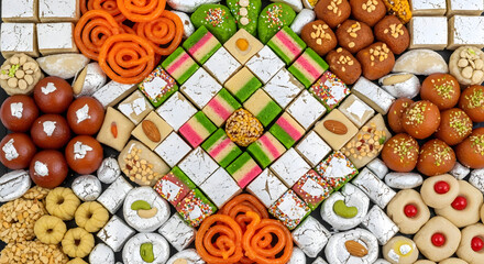 Assorted Indian Sweets in Vibrant Colors on White Background with Diverse Textures for Cultural Celebration