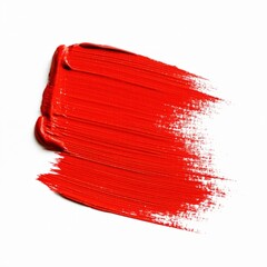 An isolated red paint brush creates textured watercolor strokes and artistic grunge designs on paper using ink and vibrant color