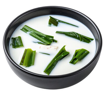 Creamy and piquant laing, a beloved filipino dish of taro leaves cooked in coconut milk, captured alone and isolated on a white background