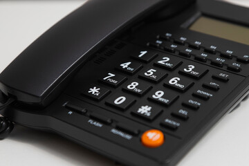 Obraz premium Black phone with a white background