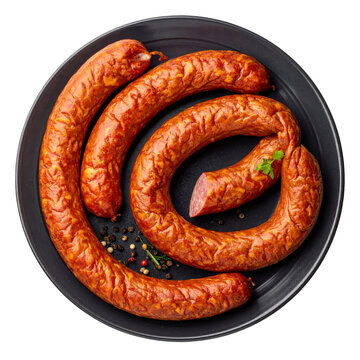 Traditional kyrgyz kazy horse sausage, sliced and arranged on a dark wooden plate, beautifully isolated on a pristine white background