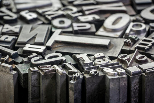 background of random vintage grunge letterpress metal type printing blocks