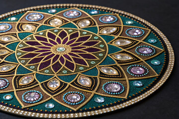 Obraz premium Circular mandala pattern made of gemstone mosaic, luxurious sparkling effect