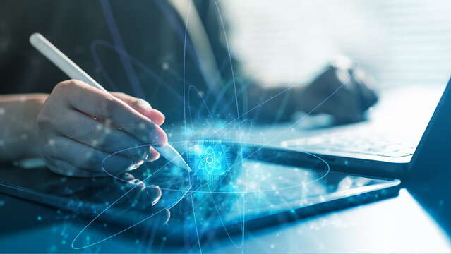 Researcher using tablet and laptop with quantum computing and AI visualization, representing advanced algorithms, data analysis, artificial intelligence, and scientific innovation.
