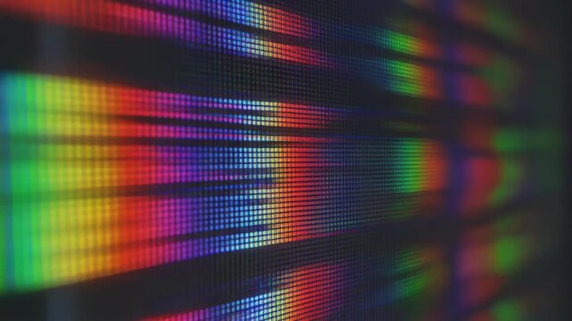 Close-up of LCD monitor pixels displaying rainbow spectrum glitch and signal interference