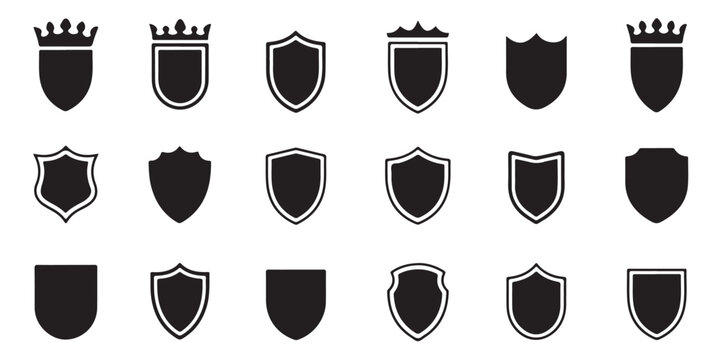 Collection of shield emblems with crowns and intricate borders on white background vector