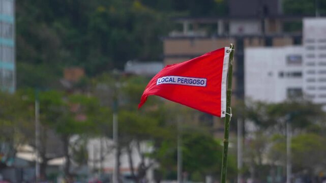 Red flag warns of dangerous conditions at Atalaia beach, Itajai, Brazil