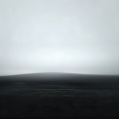 Fototapeta premium Foggy grey landscape with vast misty sky and simple horizon line. Minimalist nature atmosphere for design concepts and creative backgrounds