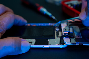 Close-up, Hand of man Repair Smartphone or Mobile phone.