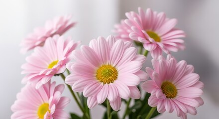 Obraz premium Perfume bottle with citrus fruit slices and white blossoms on white.