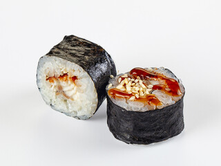 Unagi maki sushi rolls with teriyaki sauce and sesame seeds isolated on white background © Andrei Starostin