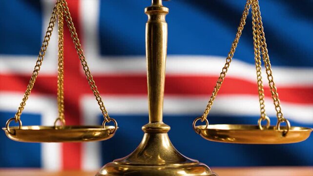 Golden scales of justice balanced evenly in front of the Icelandic flag