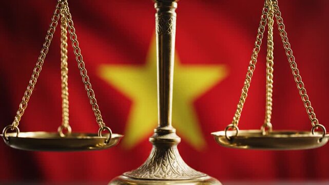 Golden scales of justice balanced in front of the Vietnamese flag symbolizing law and order