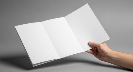 Fototapeta premium Hand Holding Open Blank Brochure 7.