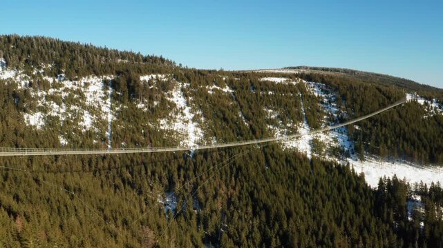 Aerial view of the worlds longest 721 meter suspension footbridge Sky Bridge tower in Dolni Morava, Czech Republic in winter