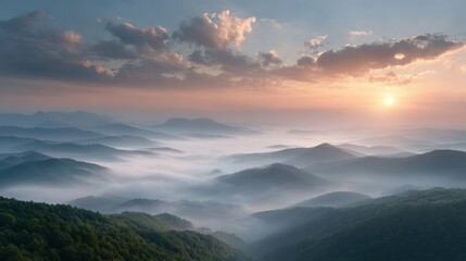 Fototapeta premium Landscape background with sunrise over misty mountain