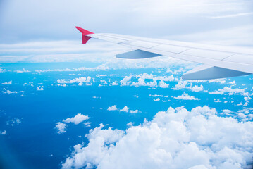 Fototapeta premium 4K Motion sky Aerial view summer tropical blue sky fluffy white cloud summertime sunny day cloudscape. Clear bright blue skyline spring sunlight climate background. Heaven blue environment