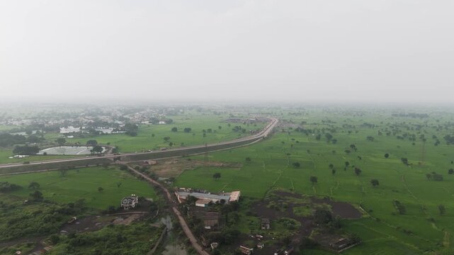 Raipur highway aerial view, National highway countryside India, Raipur Bhilai road landscape, Bilaspur highway drone view stock video.