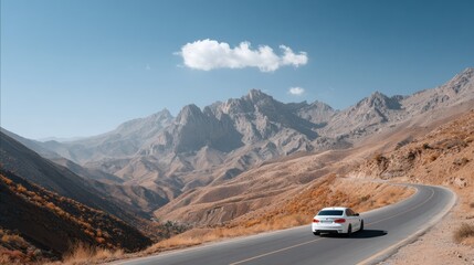 Biker on the road to the mountains