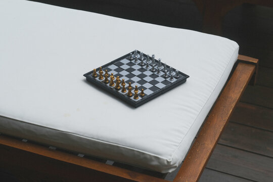 Magnetic Silver-Gold Chess Set on White Sun Lounger Mattress