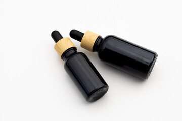 Black Serum Bottle Isolated on Clean White Background for Beauty Display