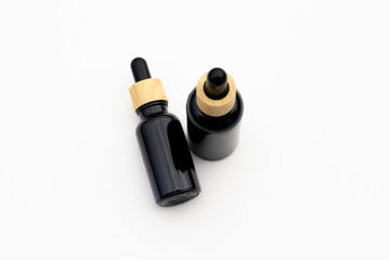 Black Serum Bottle Isolated on Clean White Background for Beauty Display