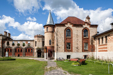 The cattle building (right) and the stable building (left) of the farmyard. Muromtsevo Estate. A 19th-century architectural monument in the neo-Gothic style. Muromtsevo, Vladimir Oblast, Russia