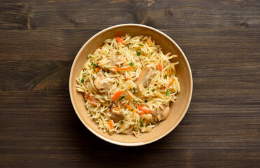Pilaf with chicken meat, onion, carrots and basmati rice