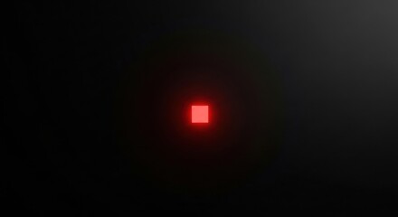 Glowing red square creating light effect on dark background