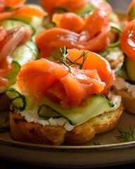 Smoked salmon toasts with cream cheese, fresh cucumber and greens