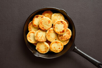 Cottage cheese pancakes in cooking pan