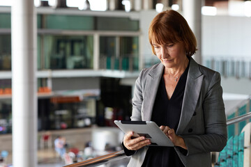 Businesswoman working on a tablet in a modern office