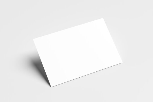Blank mockup business card isolated on a minimalist grey background. 3x2 inc