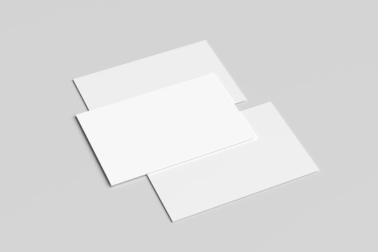 Blank mockup business card isolated on a minimalist grey background. 3x2 inc