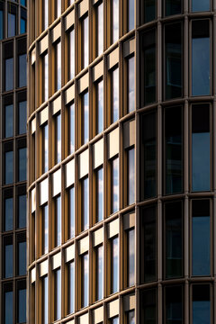 Urban architecture detail of modern building facade with office symmetry and abstract lines pattern creating minimal corporate background