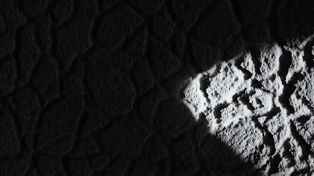 Rough, textured surface with dramatic light and shadow