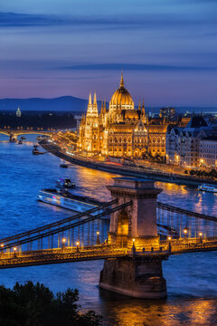 Hungary, Budapest, tranquil evening in the city with lit up Hungarian Parliament and Chain Bridge on Danube River