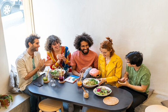 Group of friends having lunch in a restaurant