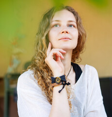 Close-up portrait of a lovely blonde woman with long wavy hair and a gentle smile