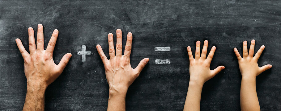 Left hands of family with two children
