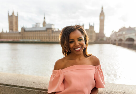 UK, London, portrait of a beautiful woman near Palace of Westminster