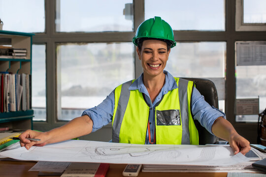 Female worker sitting in site office of quarry