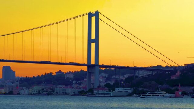 A beautiful view of the 15 July Martyrs Bridge (15 Temmuz Sehitler) silhouette at sunset in the evening, Turkey, Istanbul. Bosphorus bridge.