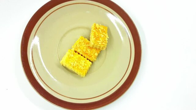 Three crispy golden fried Indonesian snack pieces served on a plate