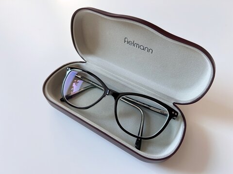 Close-up of Fielmann branded eyeglasses placed inside an open protective case on a neutral background in Gdynia, Poland February 15, 2026