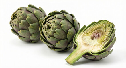 Fresh Globe Artichokes on White Background With One Halved Showing Interior Heart and Leaves.
