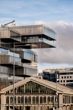 Modern landmark architecture in Paris France with concrete structure shaping an urban skyline under cloudy light showing bold city forms and strong design