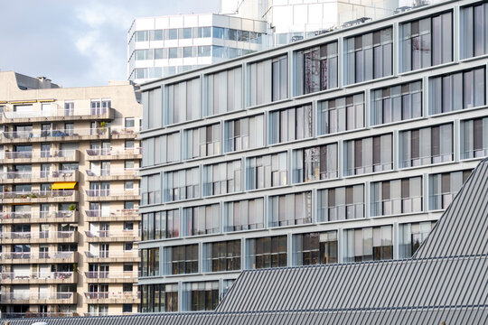 Modern architecture in Paris France showing office and apartment buildings with facade windows and balcony details in an urban wide skyline composition