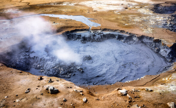 Explore N&aacute;maskar&eth; hot springs in Iceland with bubbling mud and steam